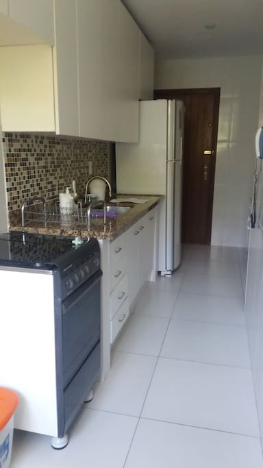 Big kitchen with refrigerator, oven and water filter