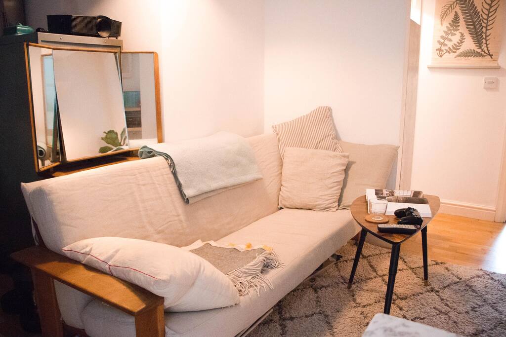 Long sofa (200cm) in the living room. Projector above.