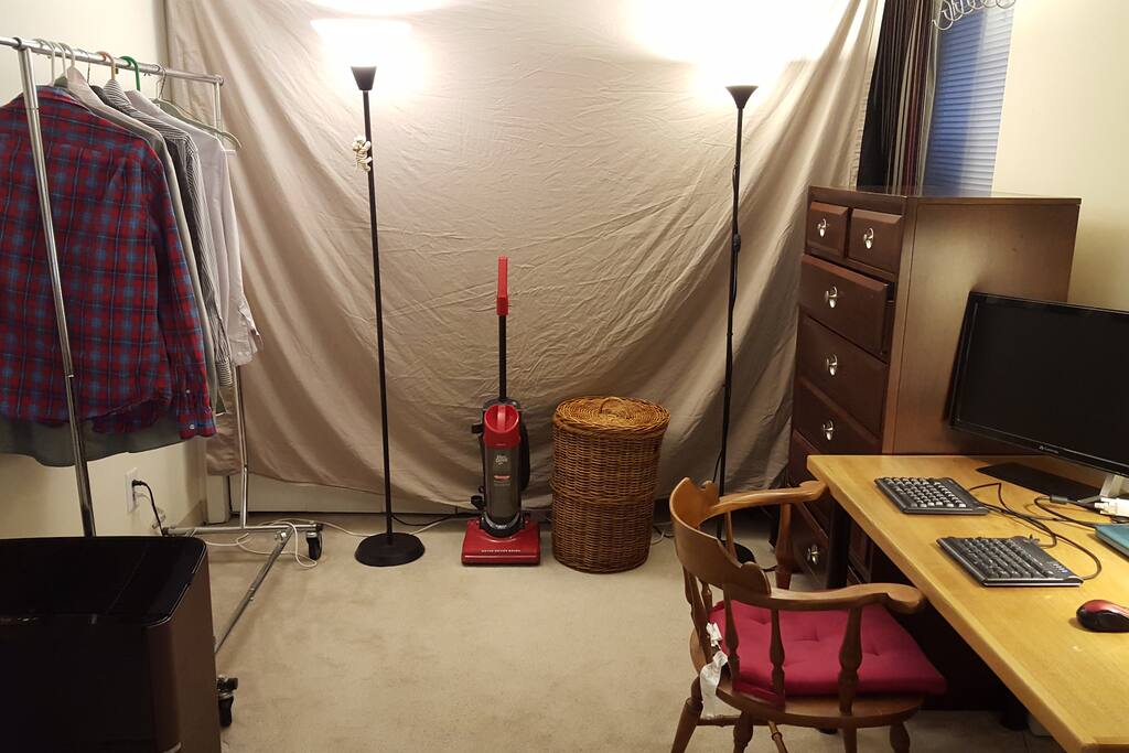 two lights offering lots of light, clothes hamper, sturdy clothes hanging rack, wood 7-drawer dresser