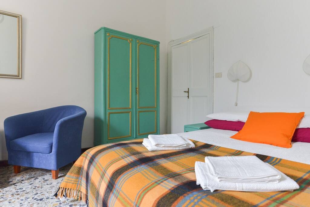 Double room 1. Cozy big double room. It has two cupboards, two armchairs for relaxing and a big table with chairs.