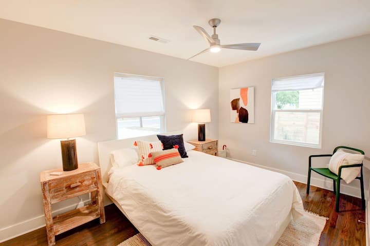 Very comfortable queen bed in this guest room with great natural light.