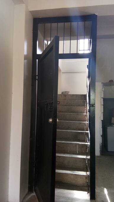 secured entrance gate up to the 2nd floor area where the room for rent is.