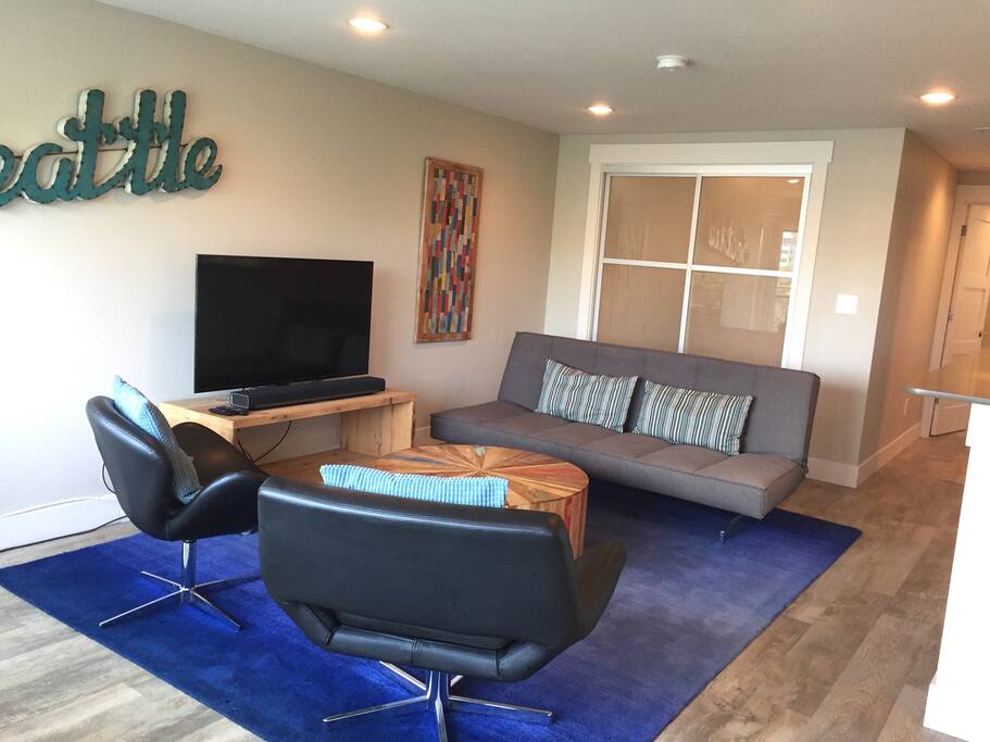 Living room sofa folds flat for additional sleeping space