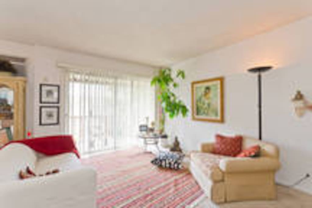 sunny living area with a balcony