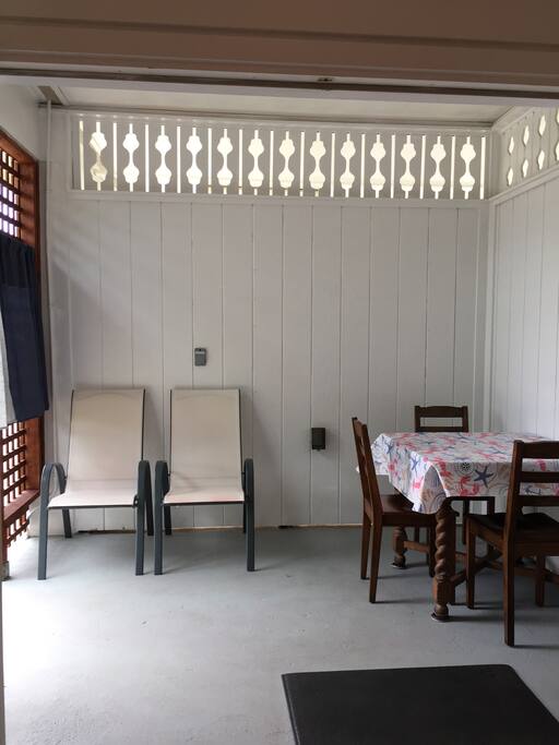Covered patio with tables and chairs