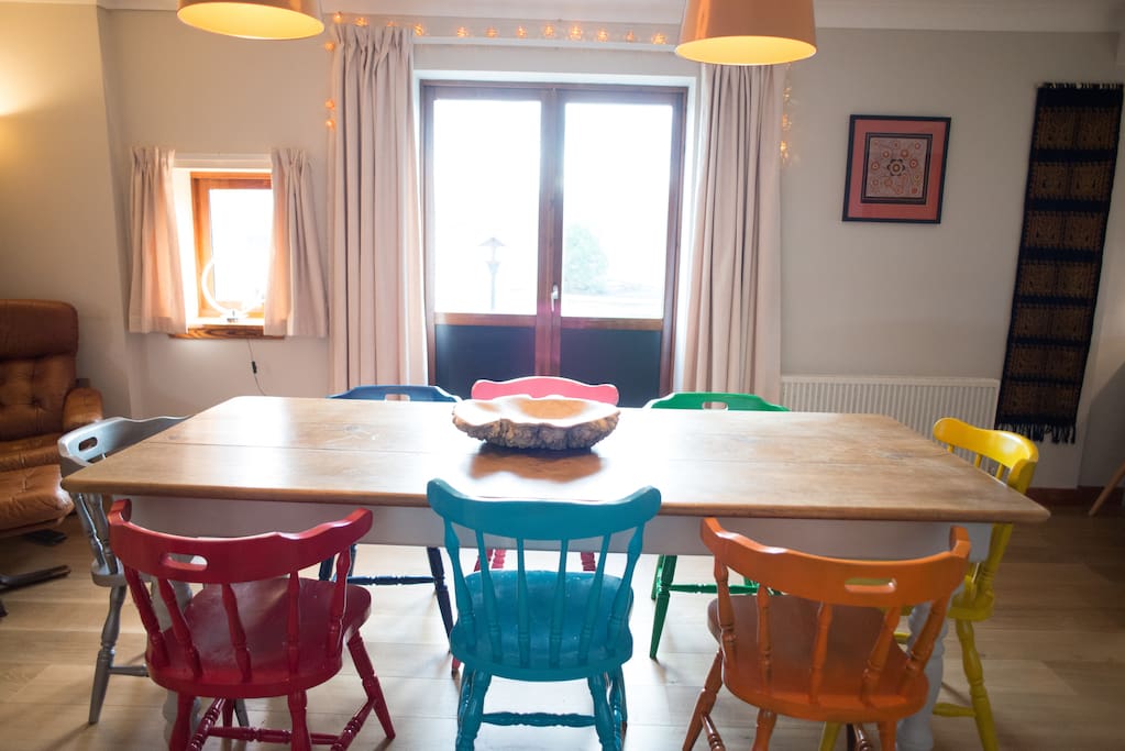 Dining table with double doors to south pacing patio