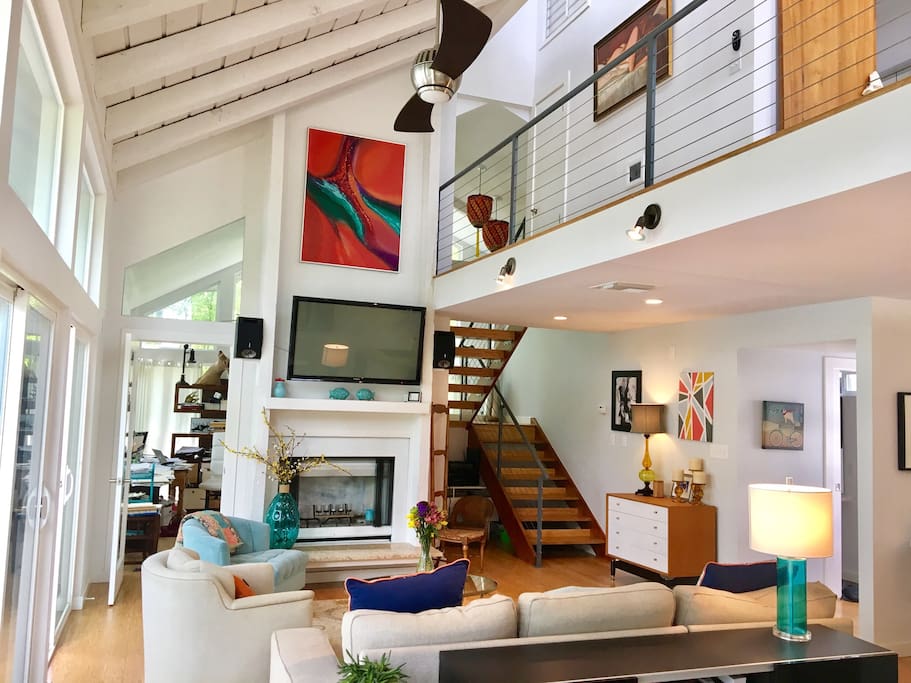 View from dining room toward the living room. The layout of this home makes it the perfect place to connect with friends and family.