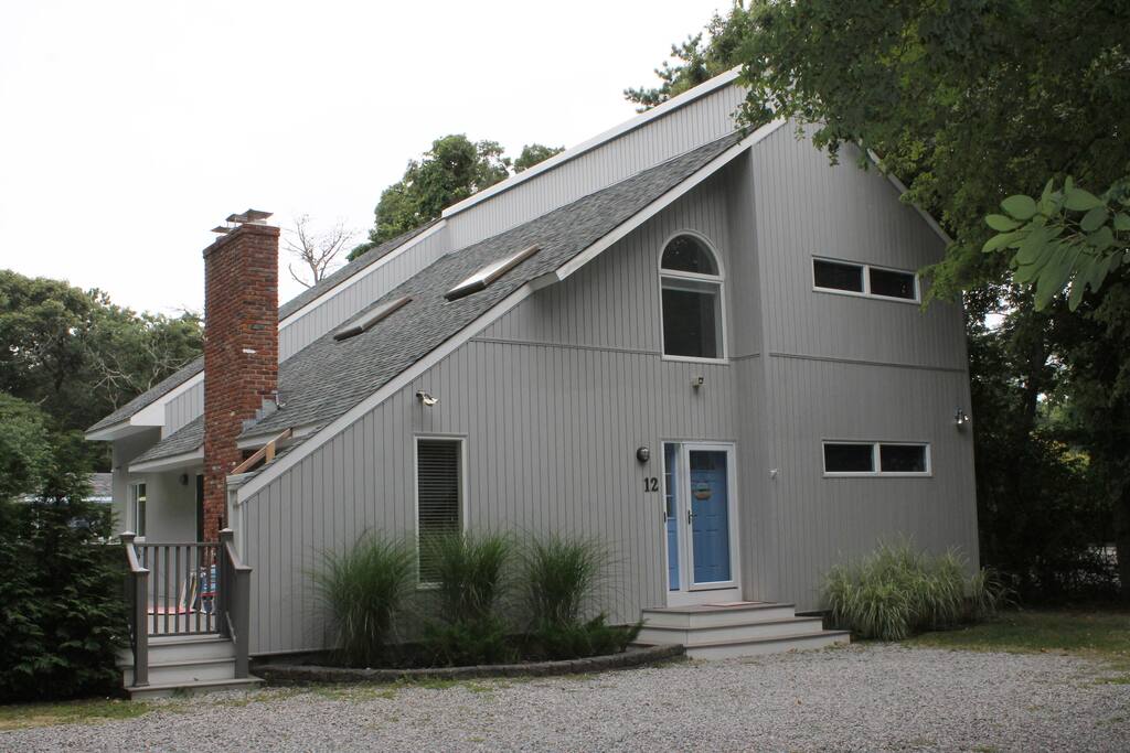 Front of the house. Large gravel driveway can accommodate up to six cars.