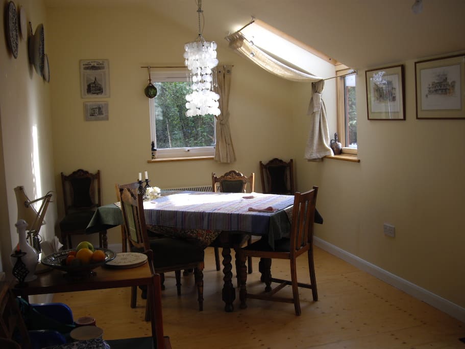 Light, airy, double aspect dining room with door to rear garden