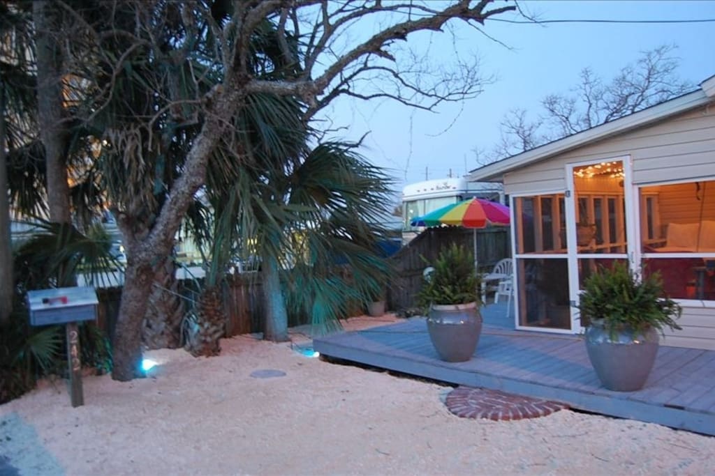 Screened in porch with parking up to the door.