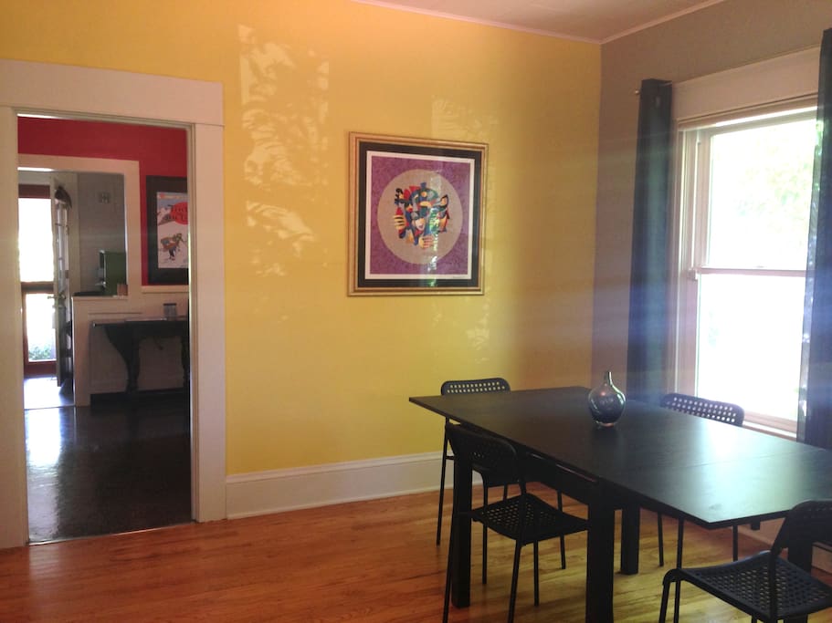 Dining area looking through kitchen into backyard