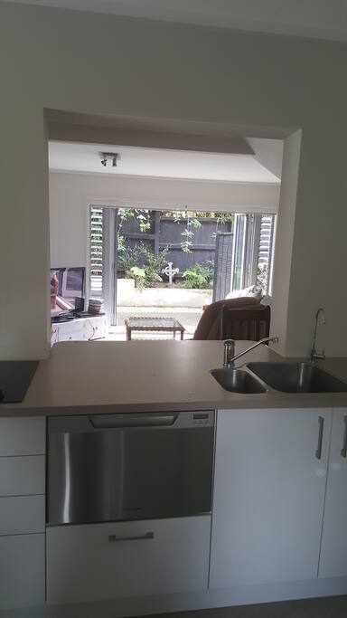Kitchen through to lounge & patio.