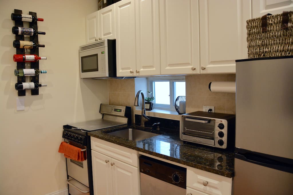 Granite countertops. Electric range with oven. Dishwasher. Toaster oven. Electric kettle.