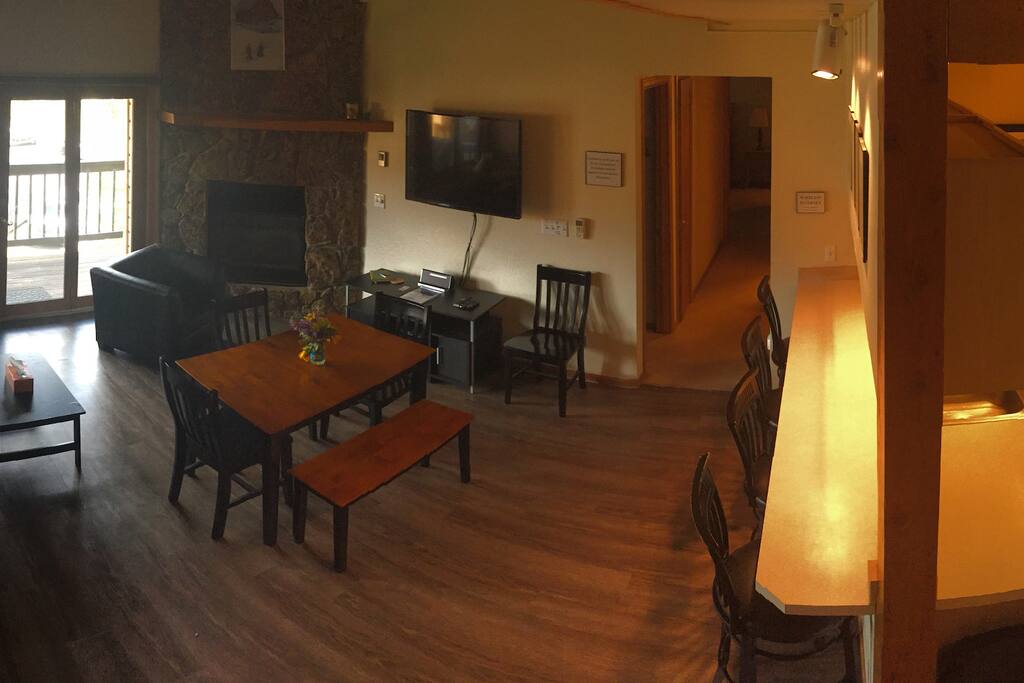 Panorama from the stairs - living room, hallway, breakfast bar, kitchen.