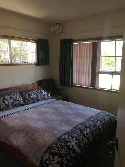 a comfortable queen size bed with full bathroom
