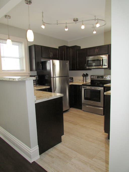 The cook's dream kitchen is fully stocked with cookware, bakeware, utensils, dishware, drinkware, flatware and linens. Garbage bags, dish soap and paper towels also provided.