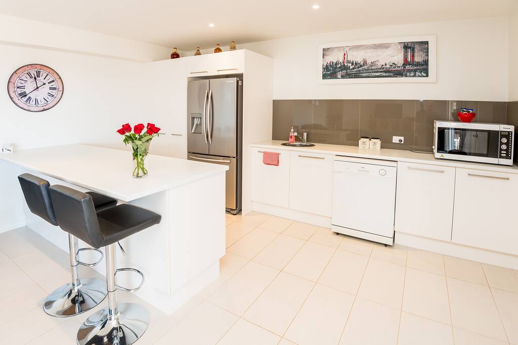 Kitchen with dishwasher and washing machine