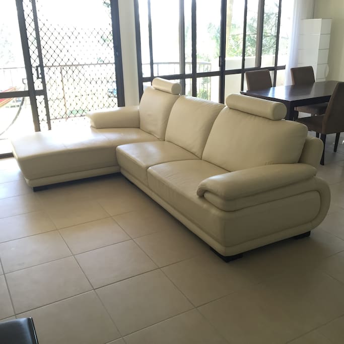 Super comfortable leather couch and 4 seat dining table