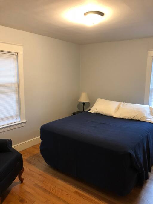 Queen size bed in the main floor bedroom.
