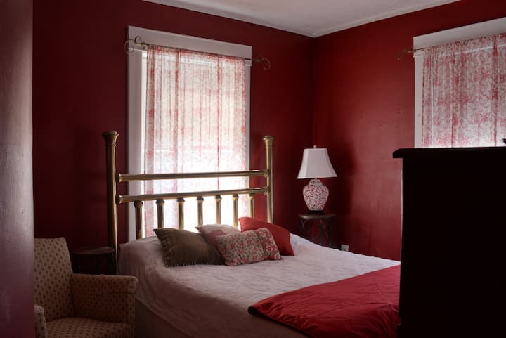 Casselman River Bedroom with queen bed, AC window unit, ceiling fan, shared bath.