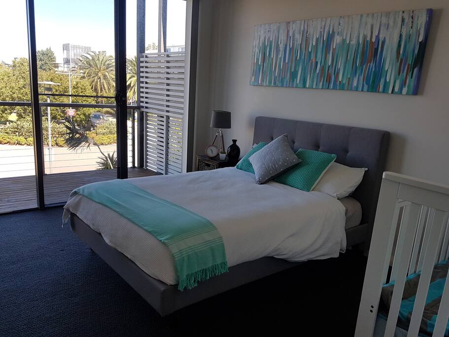 Upstairs room with balcony and view
