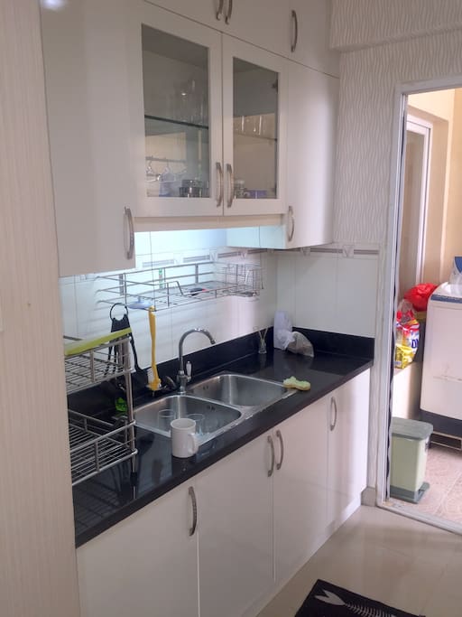 Easy cleanup and food prep area with washing machine in laundry area.