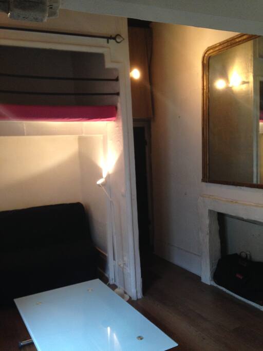 Entrance on the right, directly in the main room. Top left is the mezzanine / loft bed (sleeps 2). Below is the convertible sofa bed.