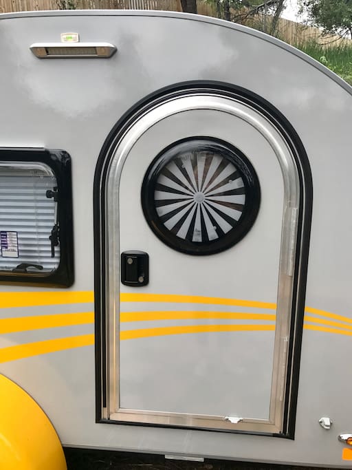 Cool doors on both sides with swirl window shades.