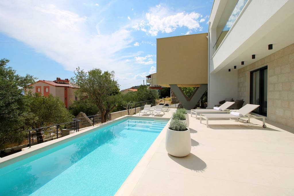 Sun deck area in front of living area and next to private pool