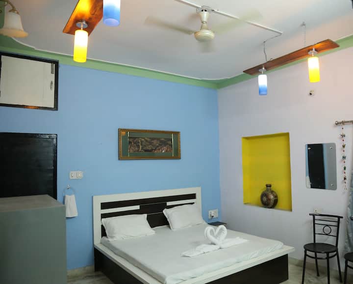 Bedroom 2, size 15 X 15 ft. with satellite TV , attached washroom, wardrobe and a  double Bed. 