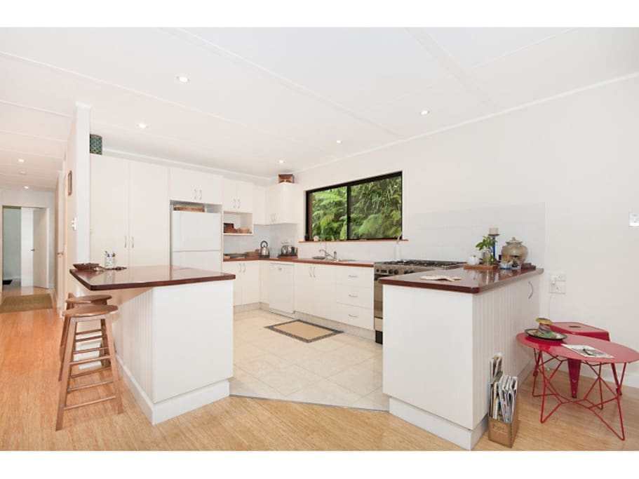 well equipped kitchen with gas stove and dishwasher