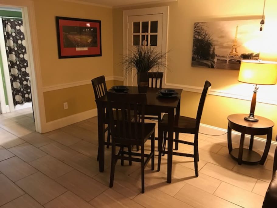 Breakfast table with private entrance in the background.