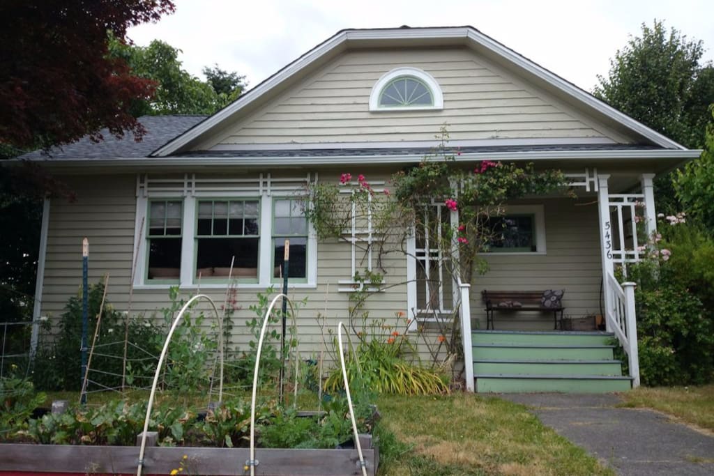Our 1916 Craftsman cottage. Depending on the season, you can help yourself to whatever is in the garden. It's extra special during Sungold tomato season.