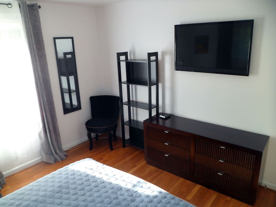 Large screen TV with wireless ear phones.
