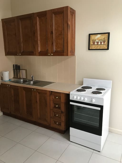 Well equipped kitchen with brand new stove, oven and grill.