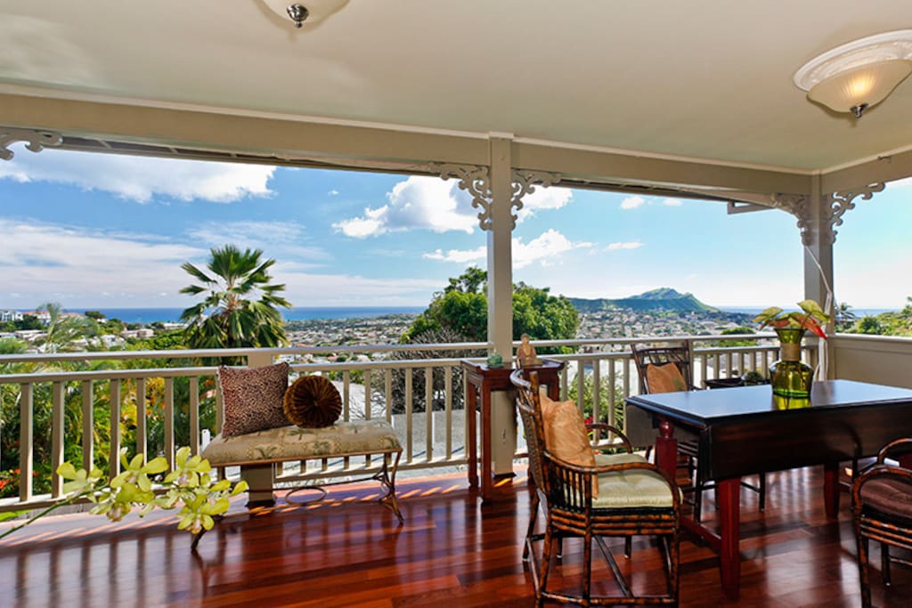 Stunning ocean views by day and city lights at night! Upstairs dining area. (Murphy bed is hidden on this lanai with comfortable Queen mattress)