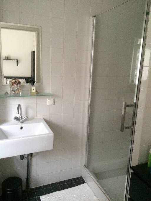 Clean and recently refurbished bathroom with large shower.