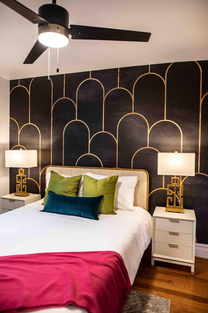 2nd floor bedroom with queen bed and blackout curtains