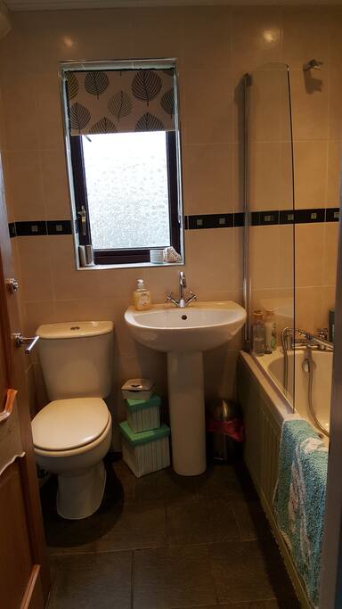 Bathroom with over bath shower