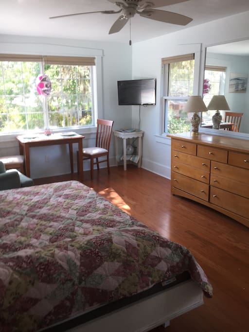 The room darkening shades can cover the entire window or just the lower half to keep it bright but private.