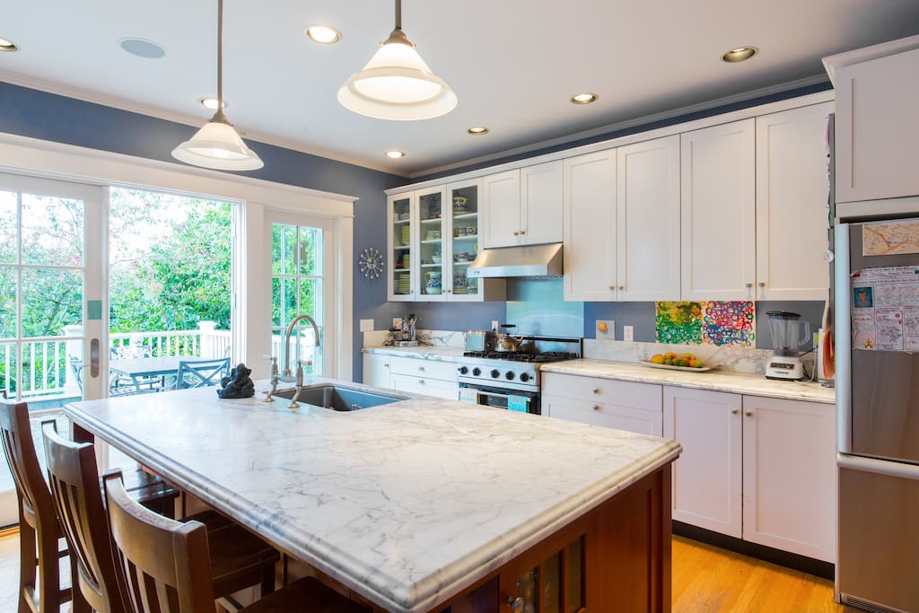 Chef's kitchen with Carrera marble counters and Viking stove