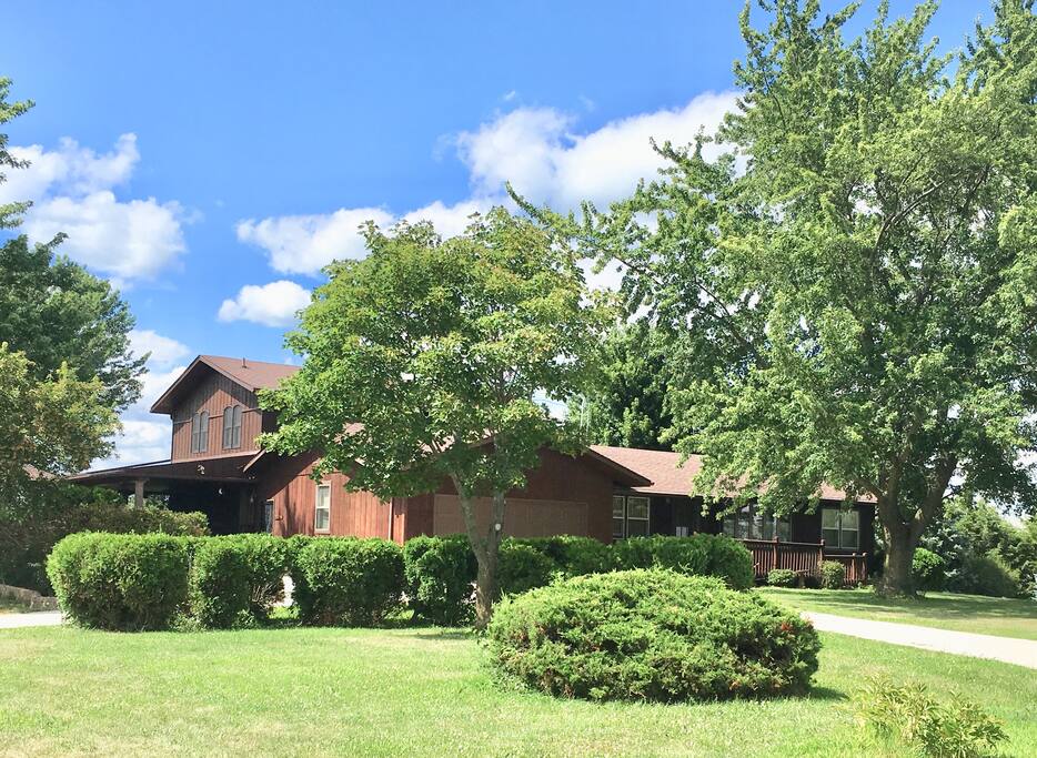 Front view with your entrance to the left of the garage on the covered deck