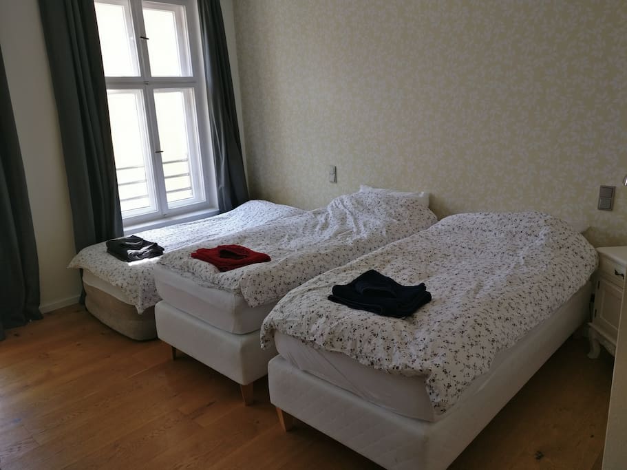 Room set up with 3 single beds