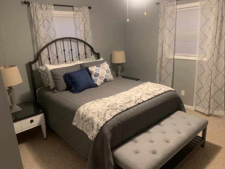 Master bedroom - Queen Size - two night stands, a small set of drawers, a mirror, and a full closet.