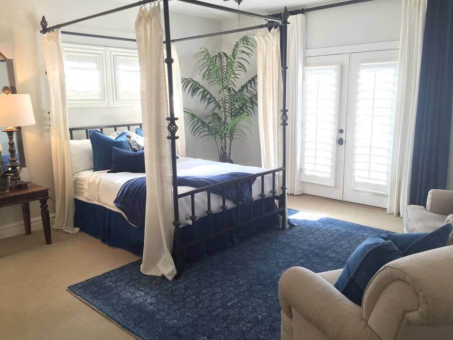 Large bedroom and sitting area with queen size bed and private ensuite bathroom