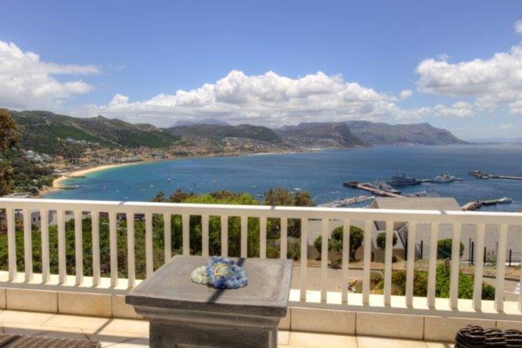 Deck with two outside chairs and braai.