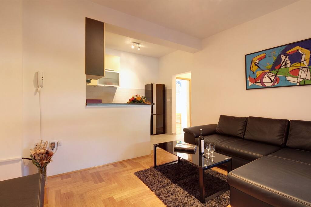 Living room with flat screen TV and AC