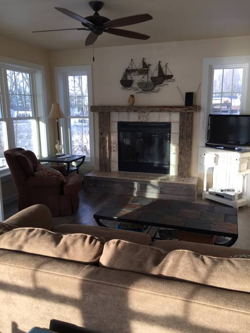 This is the living room with a beautiful fireplace.