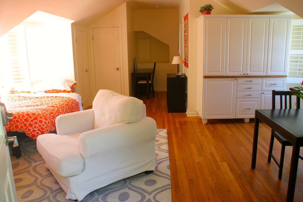 Armoire doors close off the kitchenette. An office nook gives you a quiet place to work.