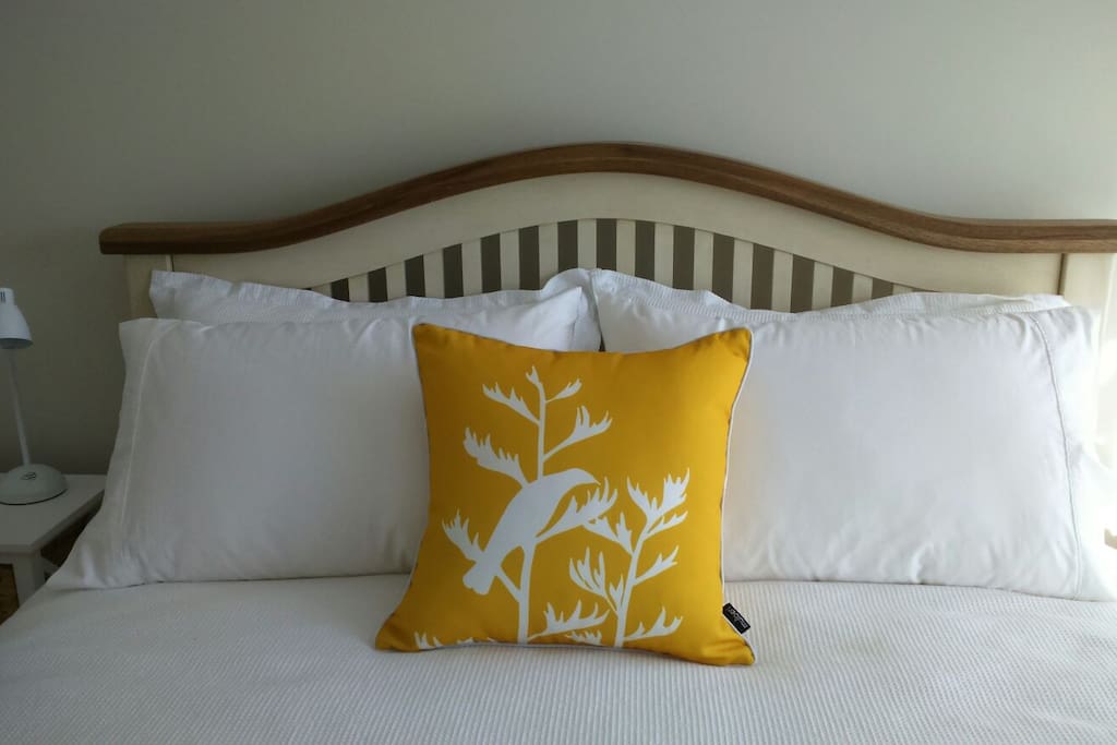 A quality, new, elegant bed and comfy mattress, with waffle linens and Tui cushion offer you luxury.